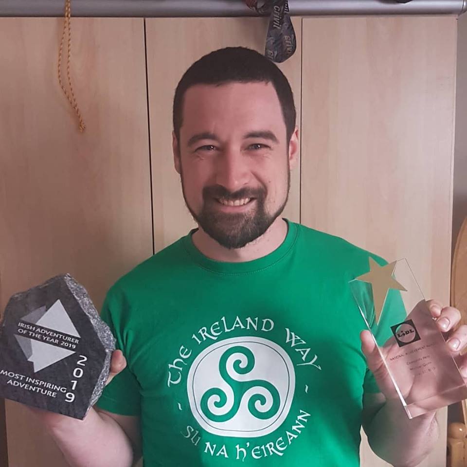 Michael Quinn with his two awards wearing the Ireland Way t-shirt